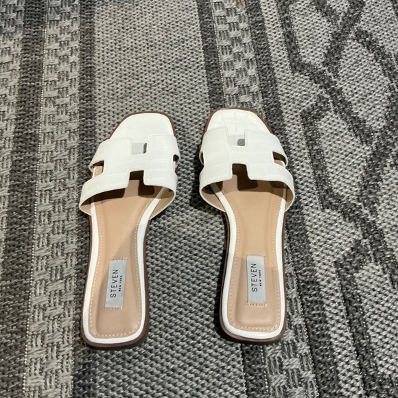 Steven New York Shoes - White sandals from the brand Steven New York at women’s size 8 1/2.